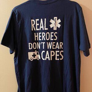 TEE SHIRT BLUE "REAL HEROES DON'T WEAR CAPES" GENTLY WORN FOR PHOTOS